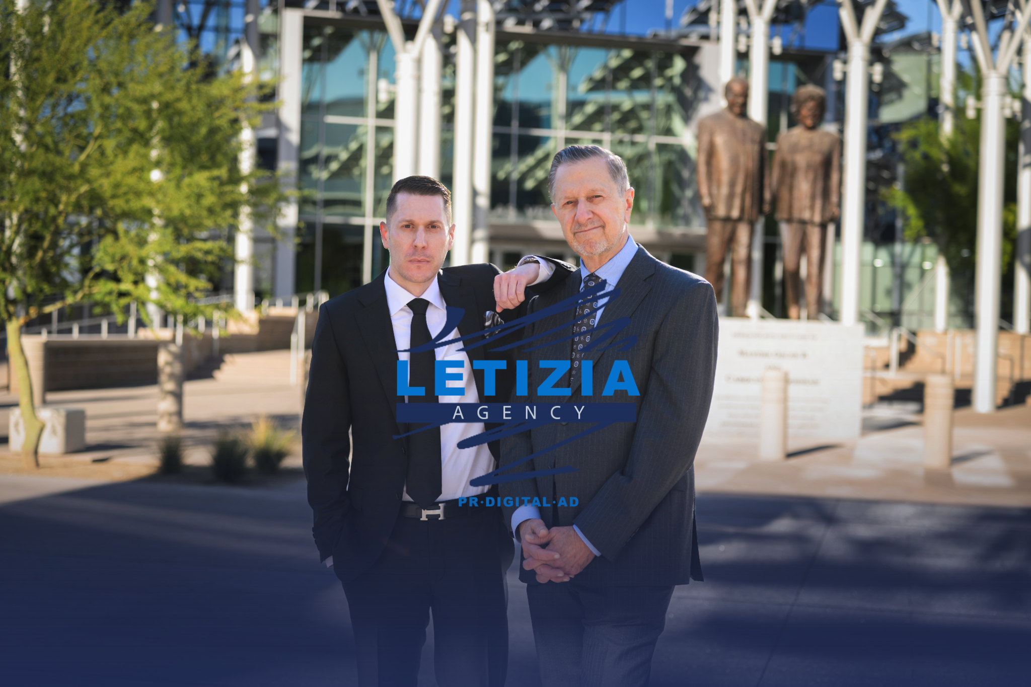 Letizia Agency team members standing outside a civic building